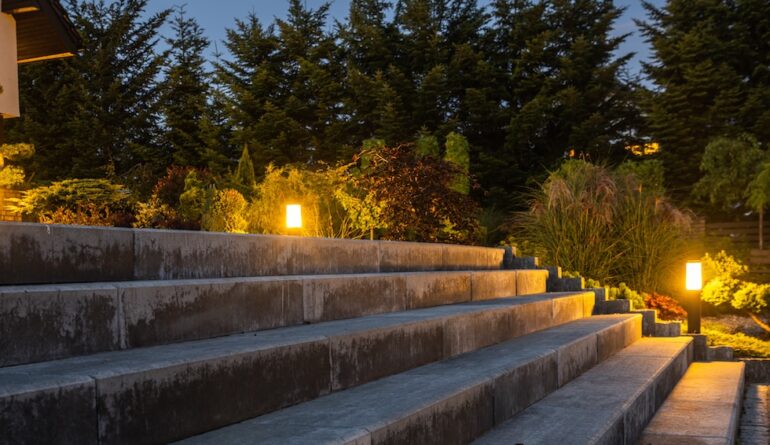 Large Garden Concrete Stairs and Illuminated Rockery Garden. Residential Architecture.