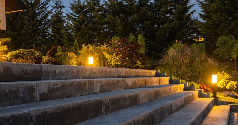 Large Garden Concrete Stairs and Illuminated Rockery Garden. Residential Architecture.