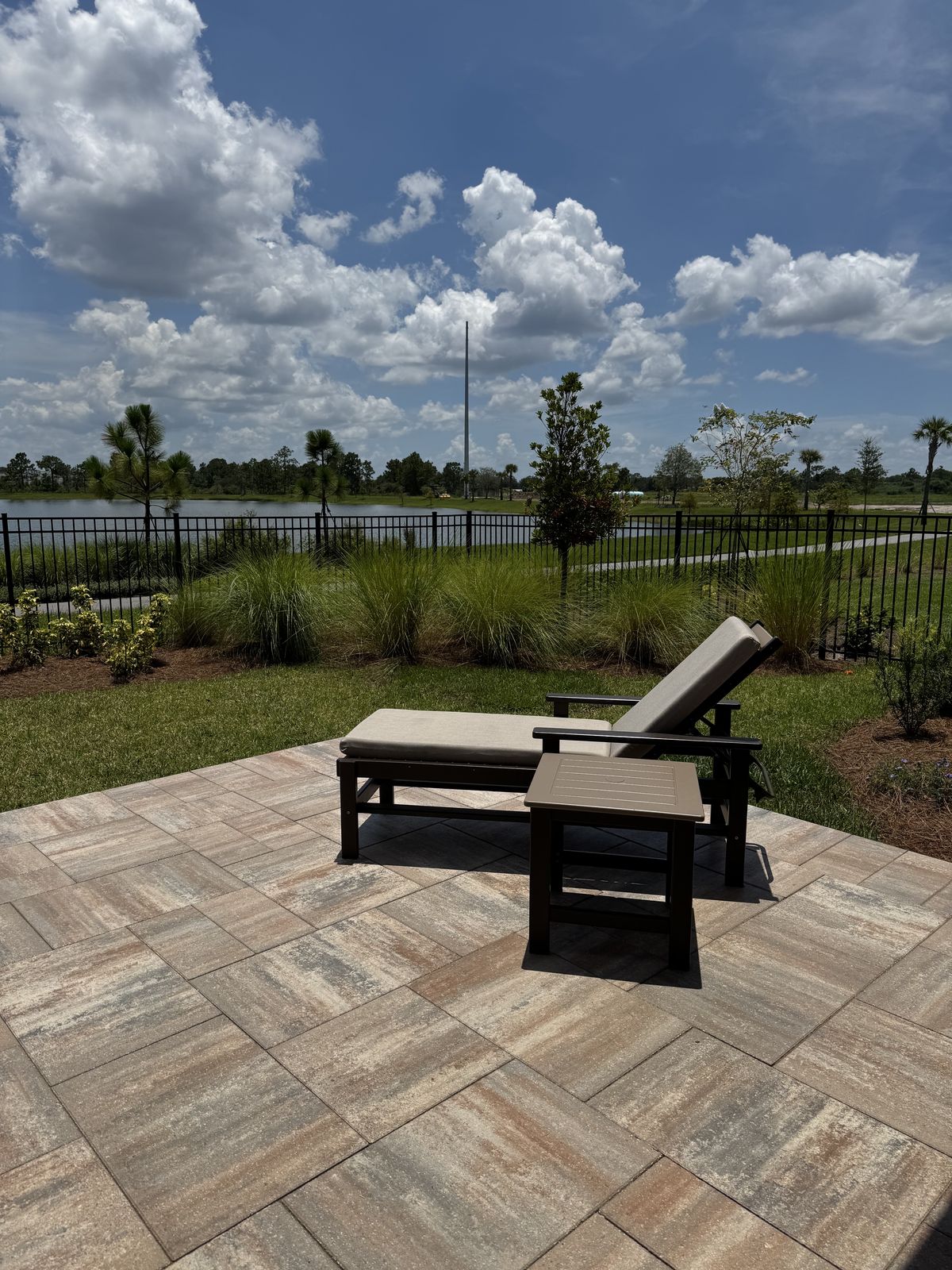 Paver patio lounge with lake view in Orlando FL
