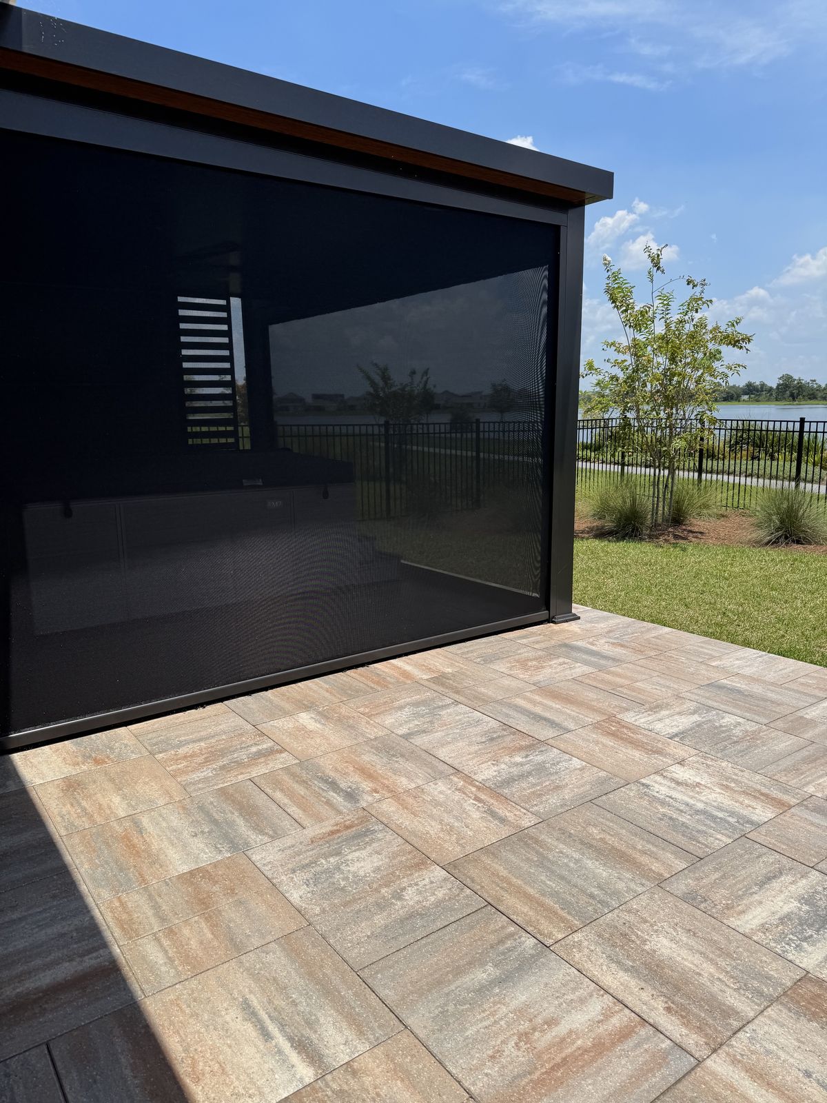 Paver patio by a screen enclosure in Orlando FL